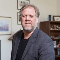 Portraits of Johnathan Bengston taking in office and lounge. Johnathan Bengston Headshot